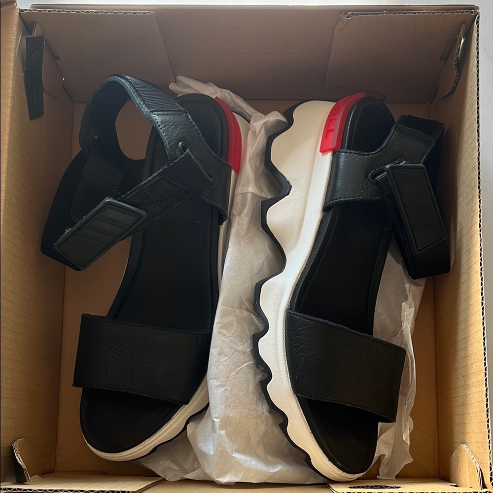 Sorel: Black and white Sandals with White Soles